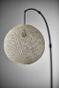 77" Antiqued Bronze Arched Floor Lamp With Groovy Beige Abstract Wicker Globe Shade
