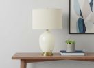 26" Gold and Ivory Ceramic Urn Table Lamp With Cream Drum Shade