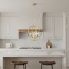 Gold And Clear Sphere Three Light Iron Ceiling Light With Clear Shades